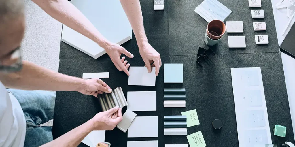 Designers selecting material samples and finishes during the development of a heat pump.