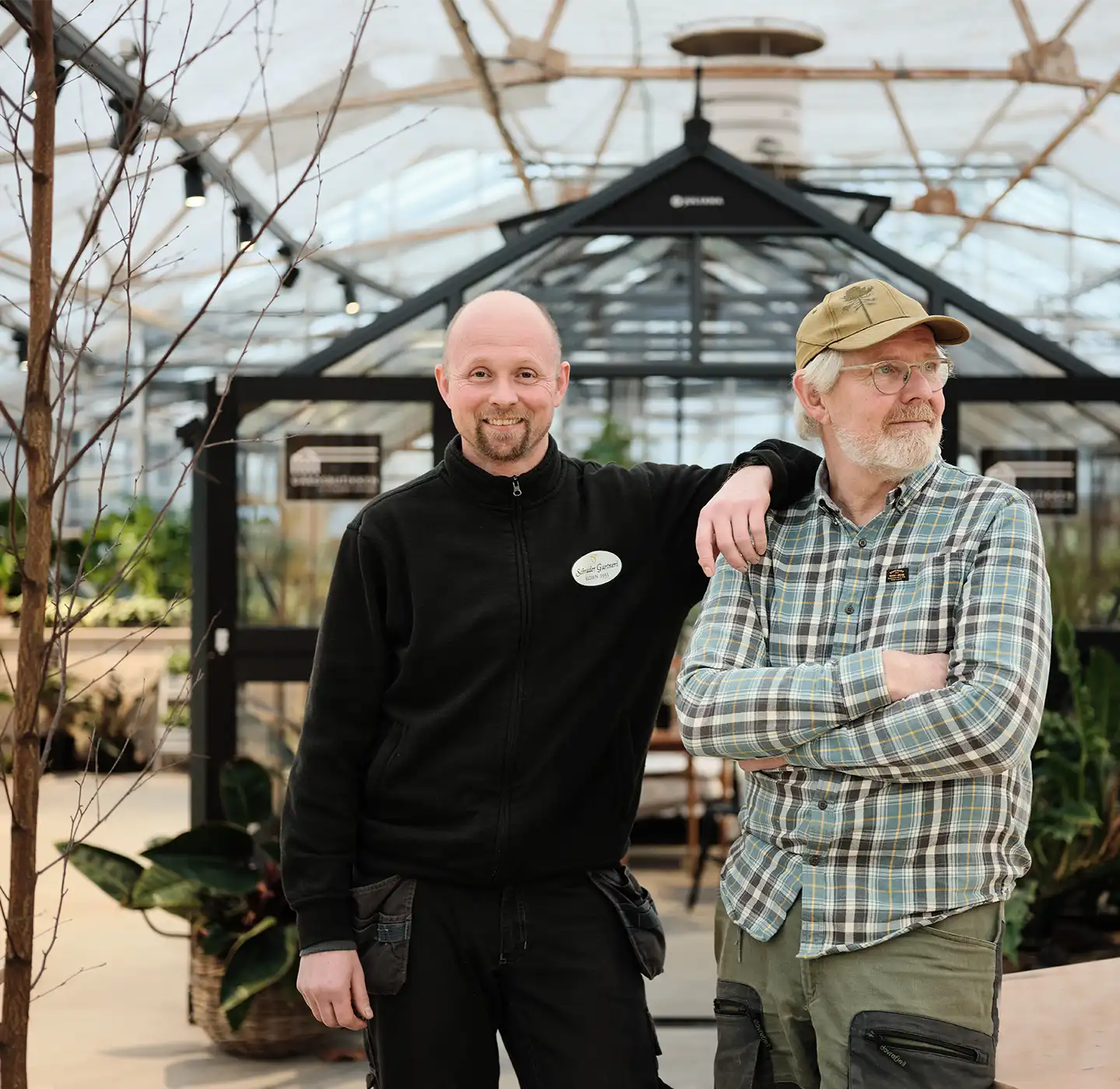 Commercial heat pump installation powering a greenhouse for efficient climate control in Norway, with two customers from Schrader Gartneri on site.
